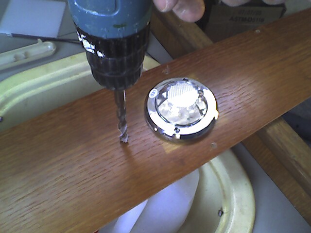 Drilling the hole to mount the switch.